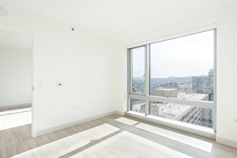 an empty room with a large window