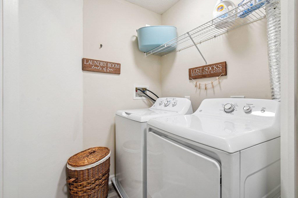 A laundry room with a washer and dryer.