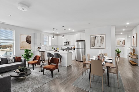 A modern kitchen with a dining table set for four.