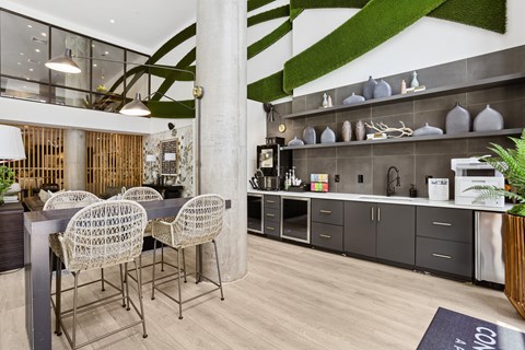 A modern dining area with a glass table and chairs.
