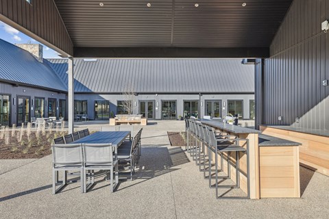 A patio with tables and chairs is shown.