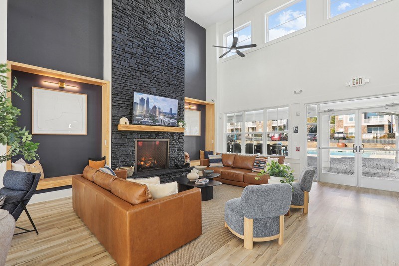 A modern living room with a fireplace and a chair.