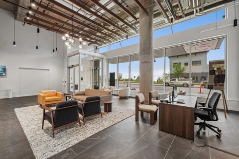 A modern office space with a wooden ceiling and furniture.