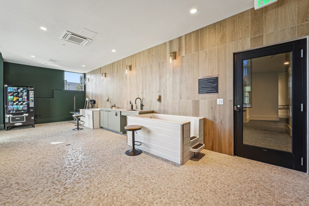 a lobby with a reception desk and a glass door