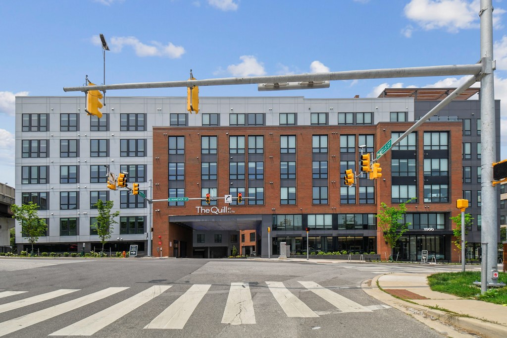 A street view of a building with a sign that reads "The Quail".