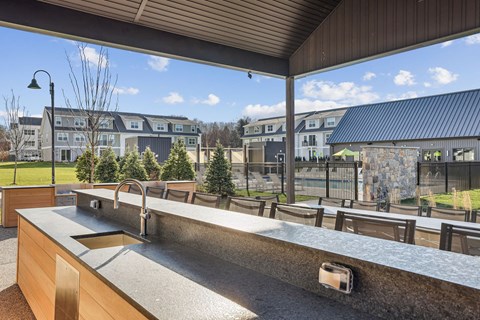 A kitchen with a long counter and sink.