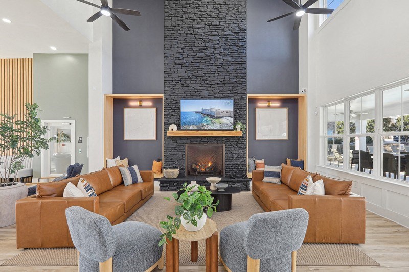 A living room with a fireplace and a television.