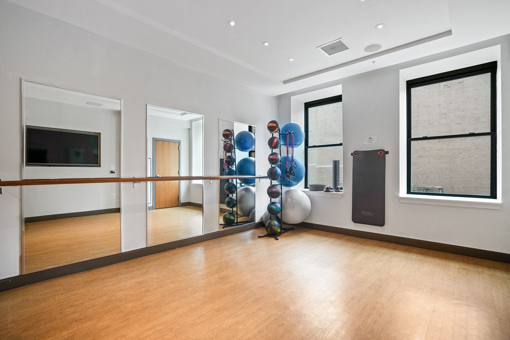 a yoga studio with a mirrored wall
