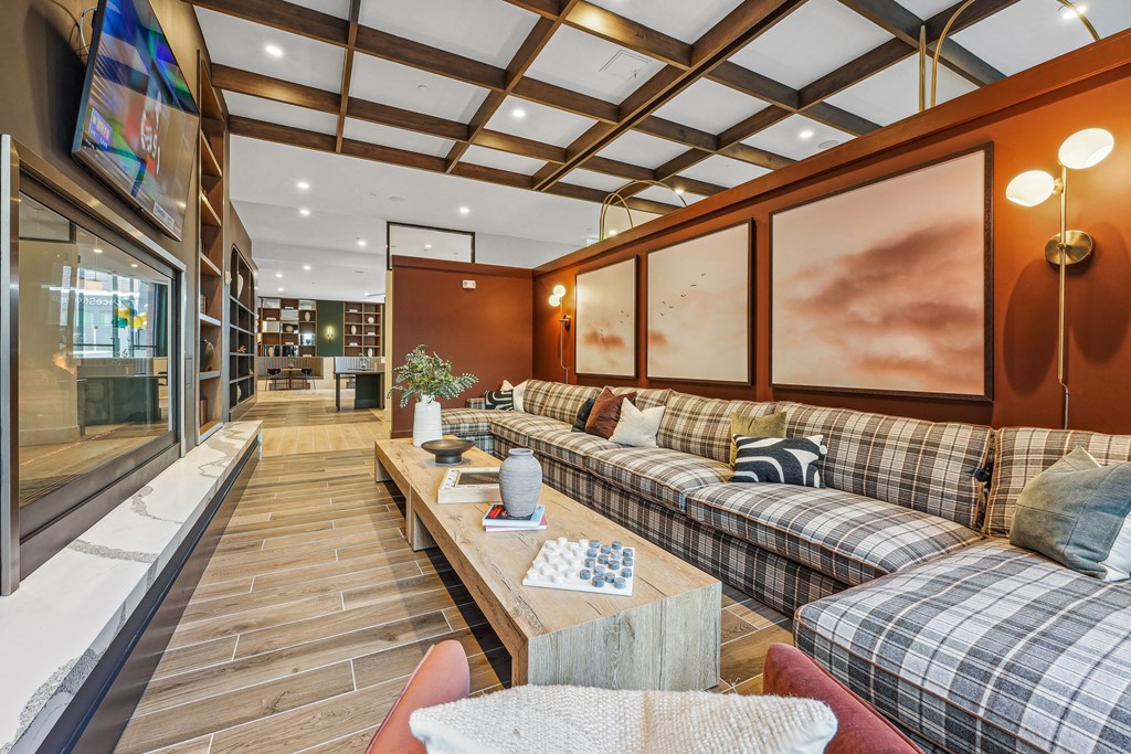 a living room filled with furniture and a staircase