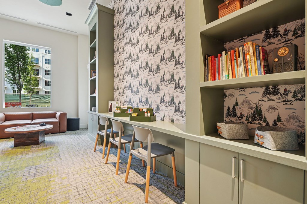 a room with a bar and chairs and a book shelf