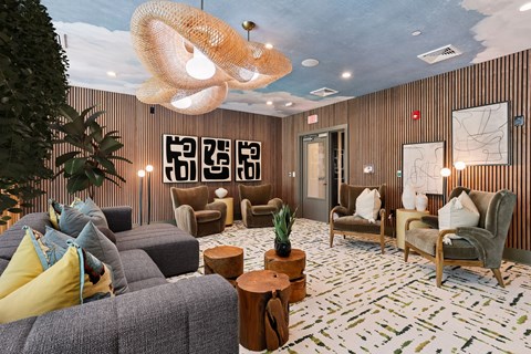 A living room with a grey sofa and a wooden coffee table.