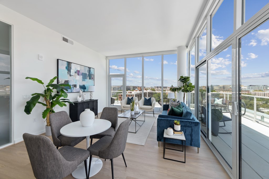 A modern dining room with a view of the city.
