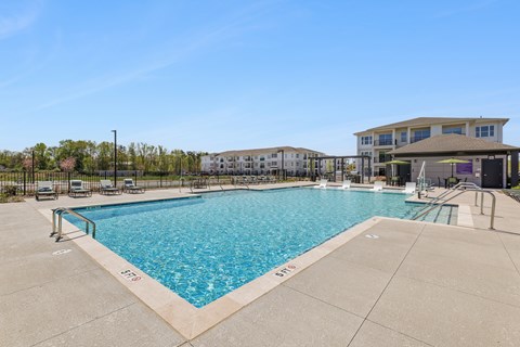 A large swimming pool with the word "SPORT" written on the edge.