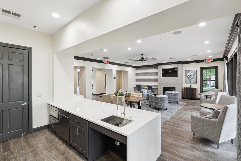 the preserve at ballantyne commons community clubhouse with kitchen and living room