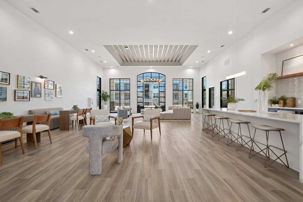 A modern living room with wooden floors and furniture.