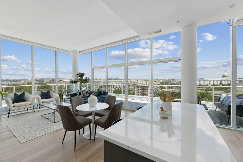 A modern dining room with a view of the city.