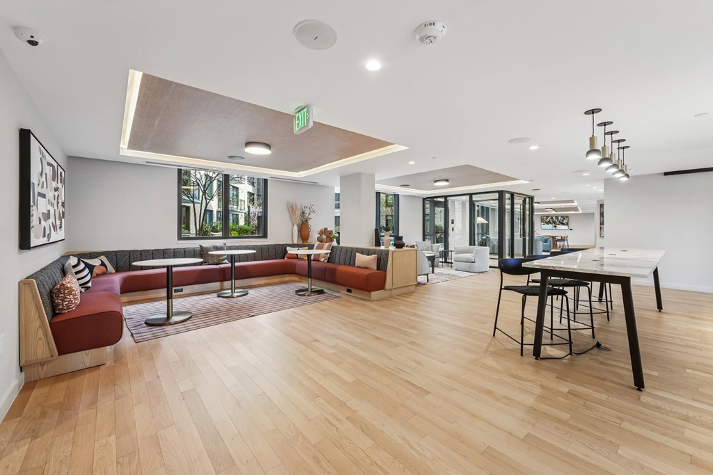 A room with a long table and chairs.