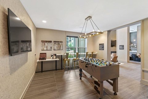 a game room with a foosball table