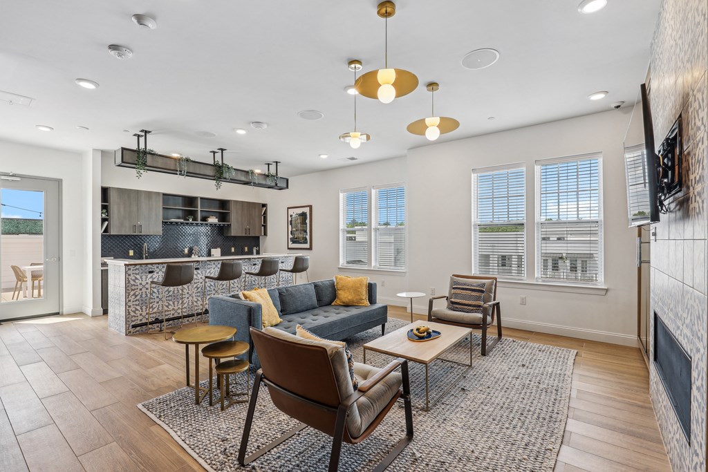a living room with a kitchen and a dining room