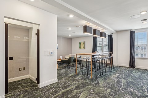 a dining room with a table and chairs and a doorway