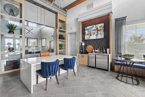 A modern kitchen with a dining table and chairs.
