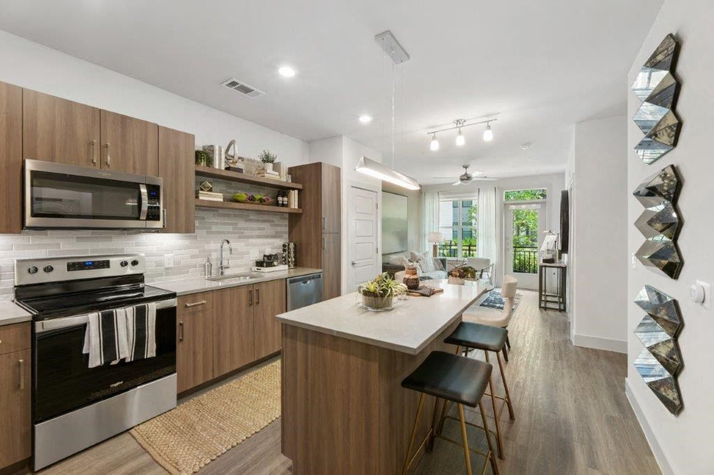 a kitchen with a large island in the middle of it