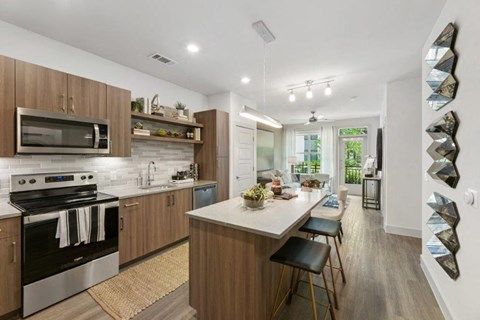 a kitchen with a large island in the middle of it