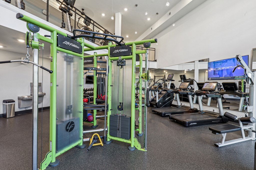 a gym with weights machines and other exercise equipment