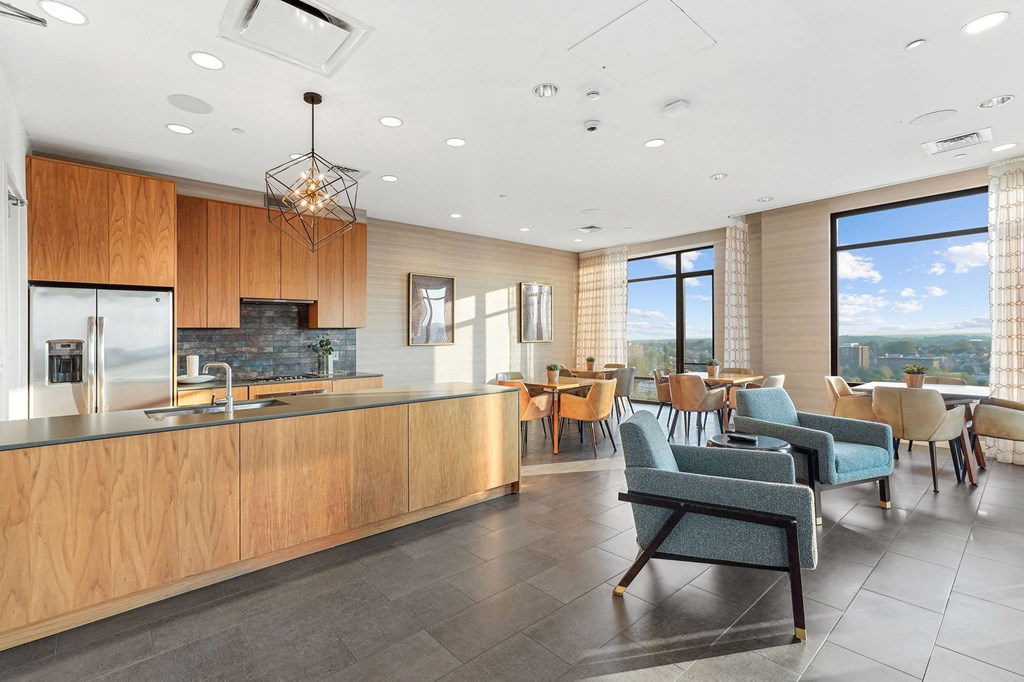 a large kitchen and dining room with a table and chairs