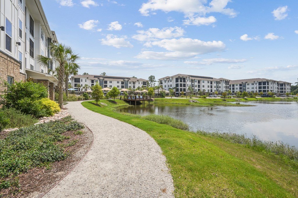 the preserve at ballantyne commons waterways with walkway and apartment buildings