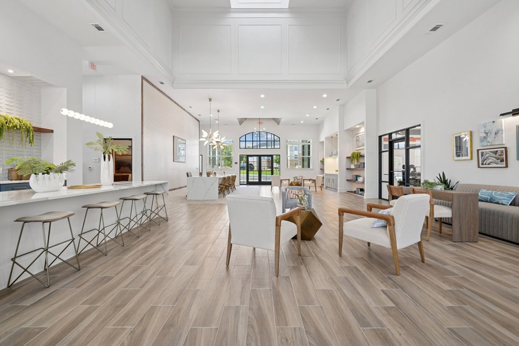 A modern living room with wooden floors and furniture.