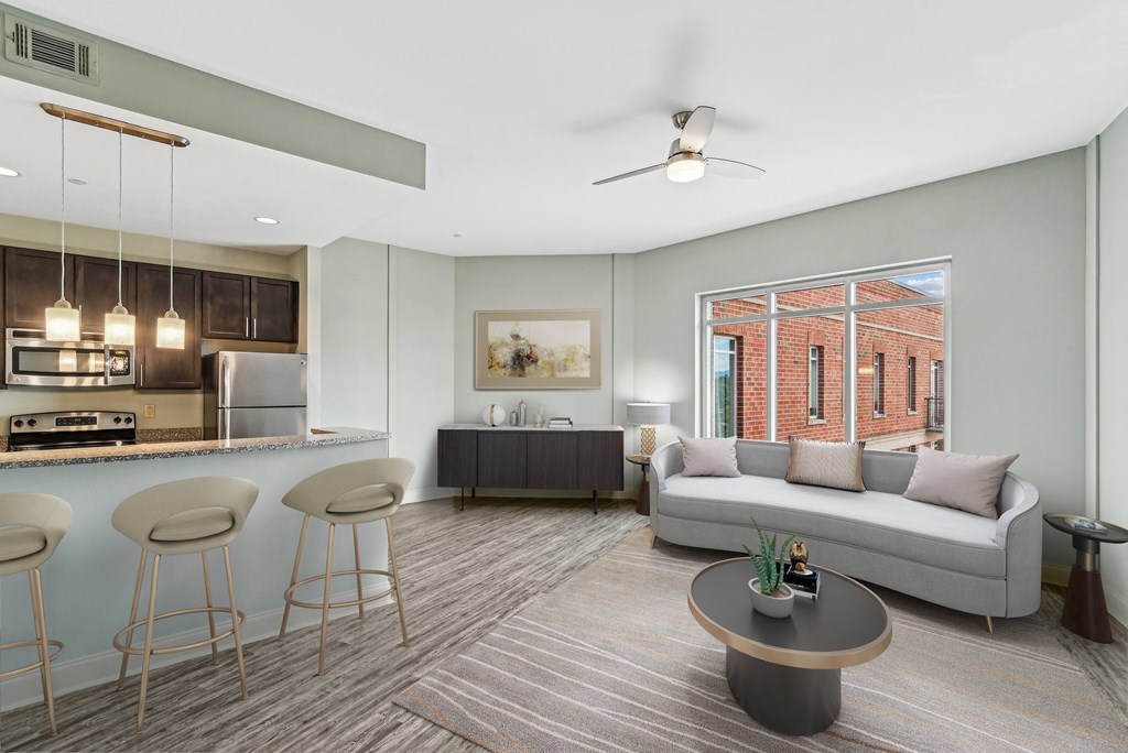 an open living room and kitchen with a couch and a table