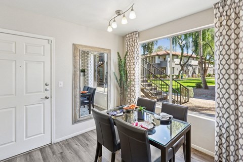 Dining Area with a Glass Table at Vista Grove Apartments, Mesa, AZ, 85204