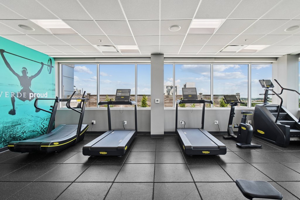 A gym with treadmills and exercise equipment.
