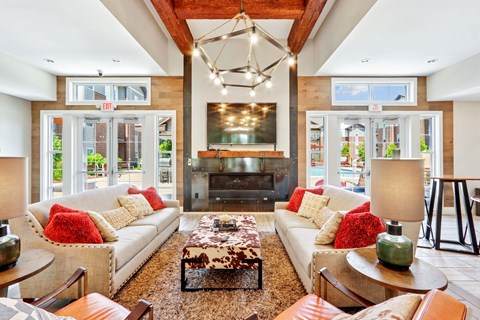 A living room with a white couch and a coffee table.
