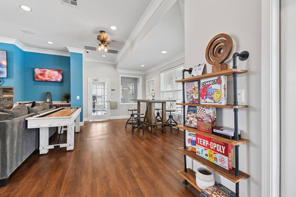 A living room with a blue wall and a TV.