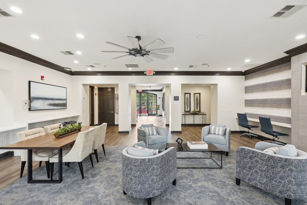 the preserve at ballantyne commons community room with couches chairs and a table