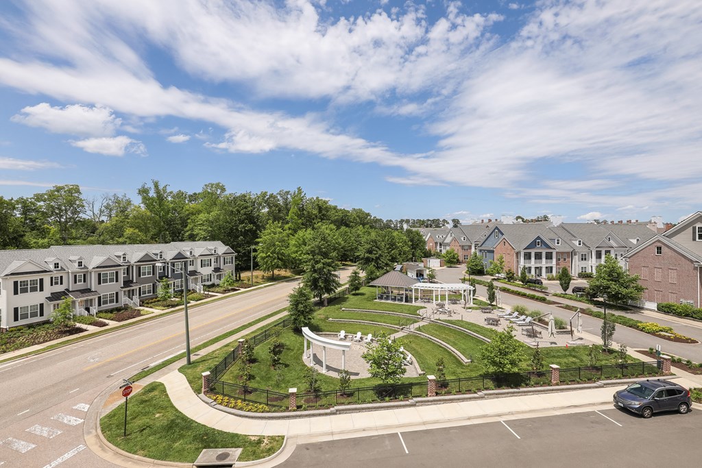 an aerial view of a neighborhood with houses and a parking lot