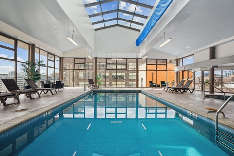 a swimming pool with glass ceilings and a large windowed pool