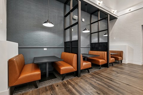 A modern dining area with a long table and chairs.