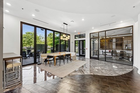 A modern dining room with a table set for four.