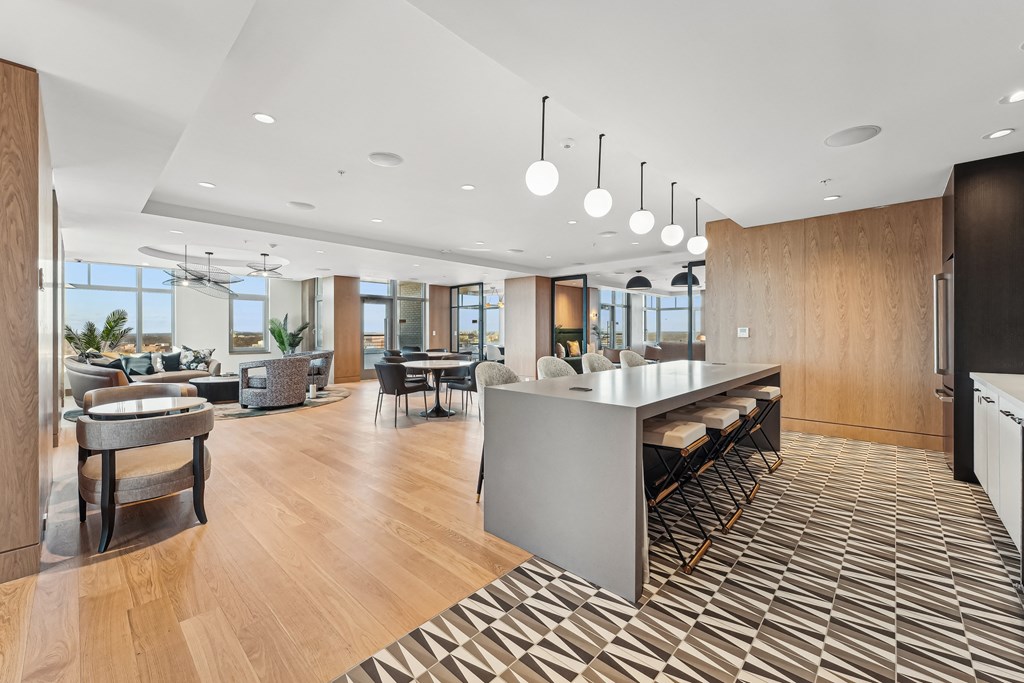 Lounges, including resident sky lounge with fireplace, TV lounge, solarium, Uber lounge, and demonstration kitchen with private dining room