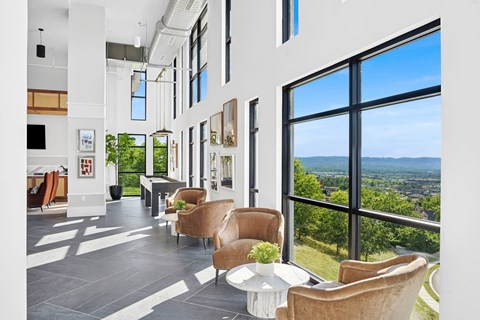A living room with a view of the city.