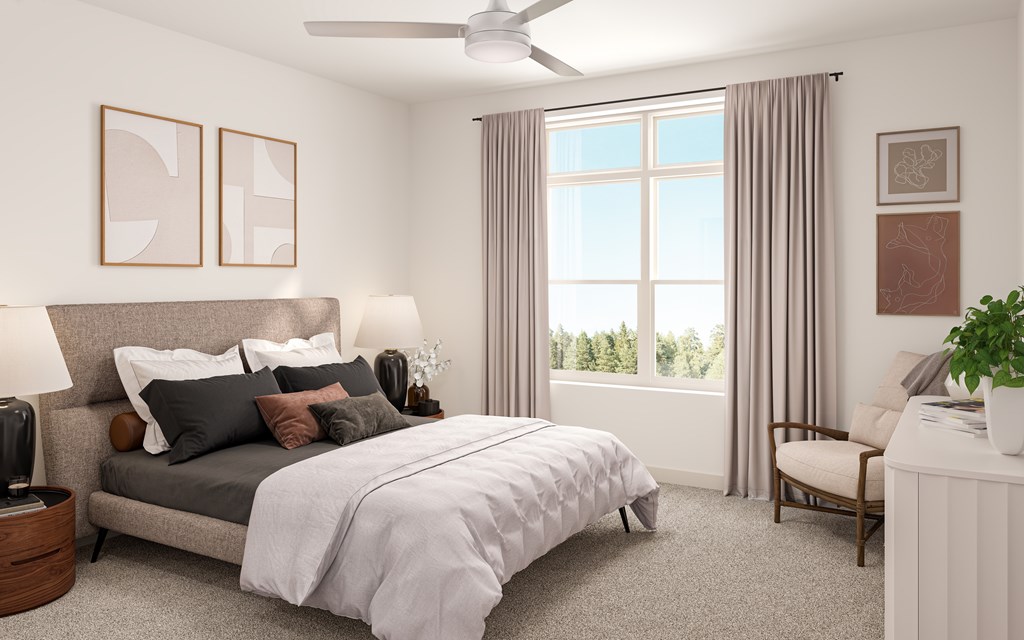 A bedroom with a bed, nightstand, and window.