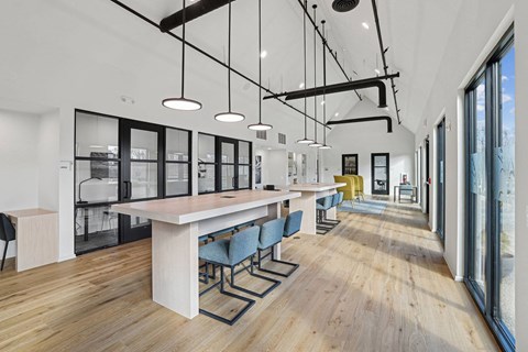 a communal area with a long table and chairs