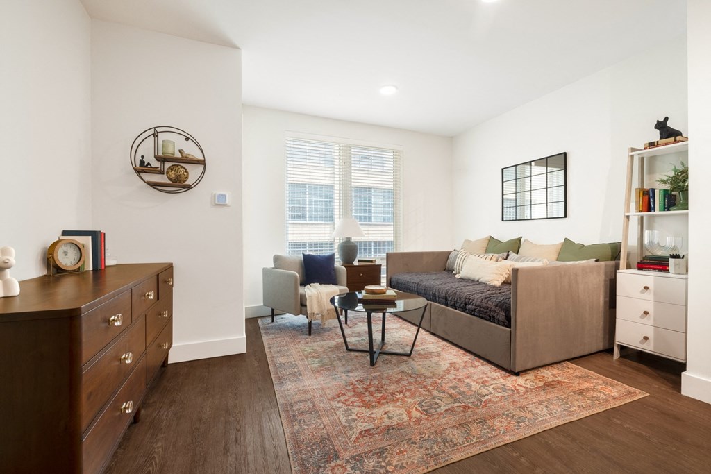 a living room with a couch and a window