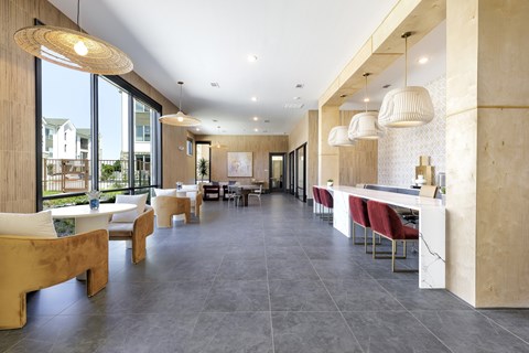 A modern dining area with a long table and chairs.