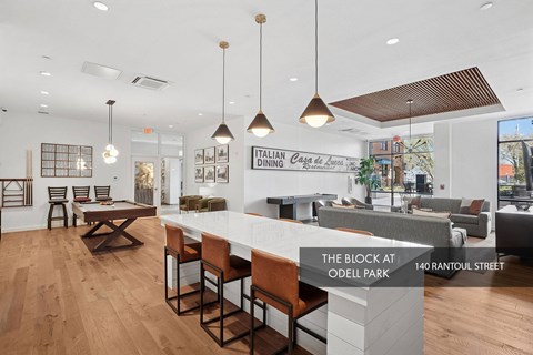 A modern interior space with a bar area and seating.