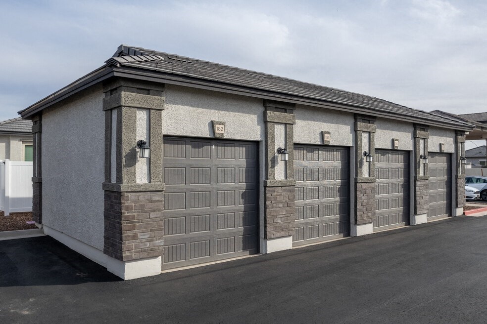 a close up of a garage with four doors