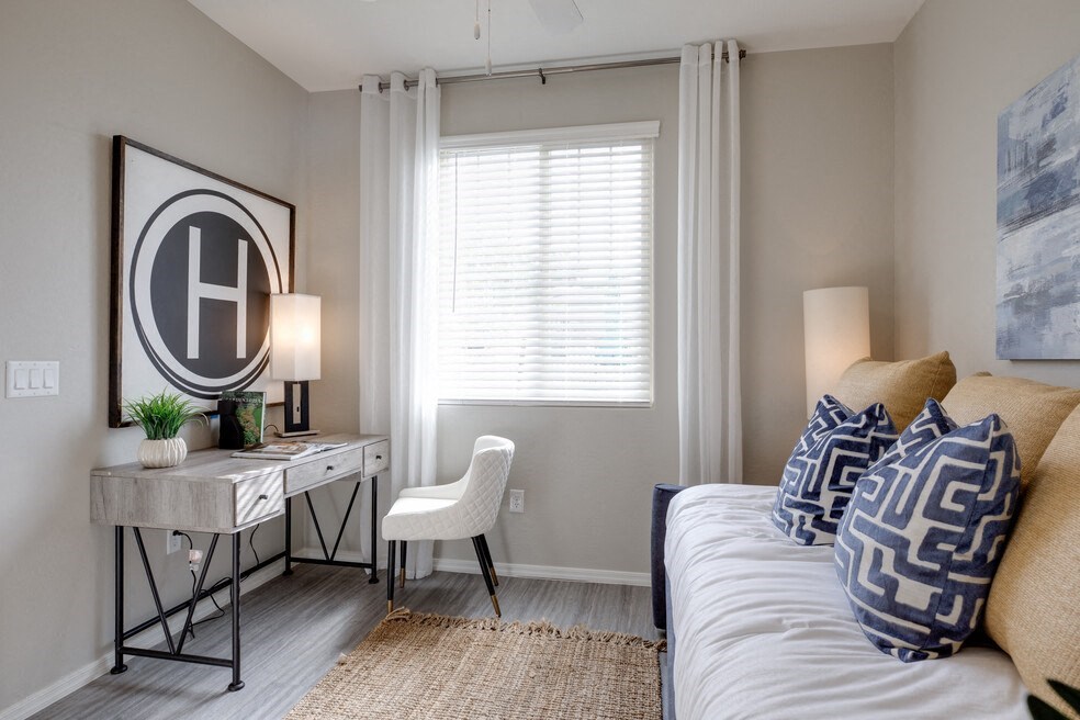 an example of a bedroom with a bed and a desk